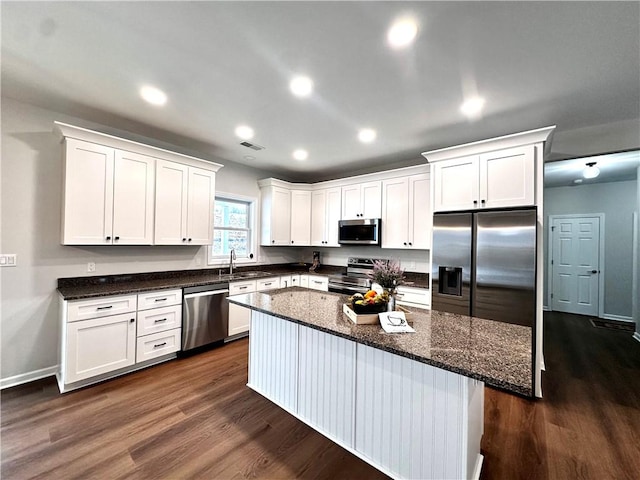 211 Ruby Dr, Menallen Twp, PA 15401 - kitchen featuring stainless steel appliances, dark wood finished floors, white cabinetry, and a sink