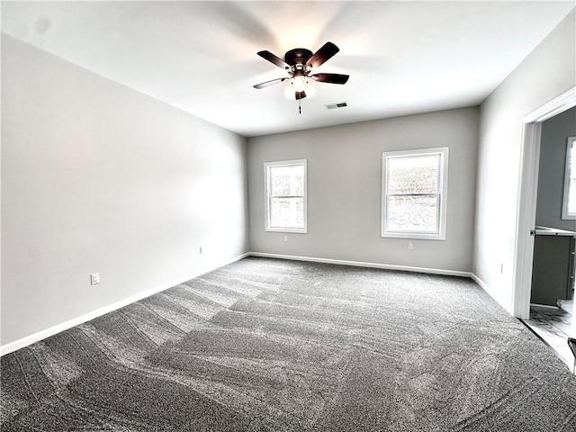 211 Ruby Dr, Menallen Twp, PA 15401 - spare room with visible vents, carpet, ceiling fan, and baseboards