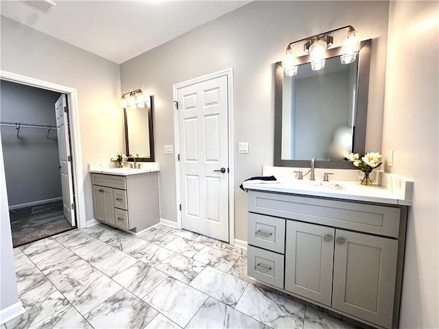 211 Ruby Dr, Menallen Twp, PA 15401 - bathroom featuring baseboards, two vanities, a sink, and marble finish floor