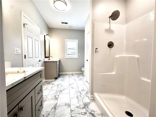 211 Ruby Dr, Menallen Twp, PA 15401 - bathroom featuring visible vents, a shower stall, two vanities, baseboards, and marble finish floor