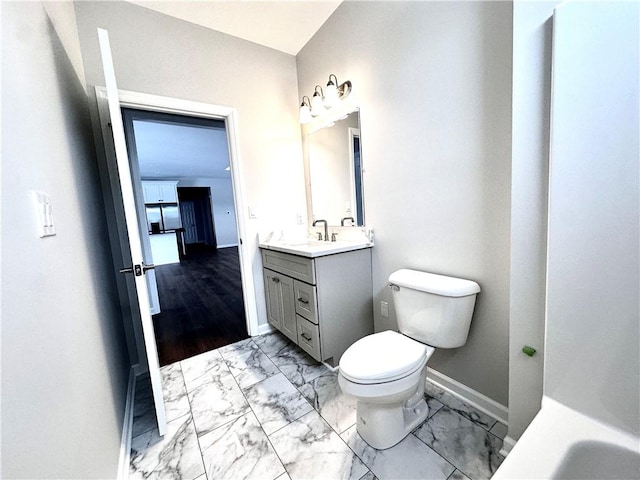 211 Ruby Dr, Menallen Twp, PA 15401 - bathroom with baseboards, marble finish floor, toilet, and vanity