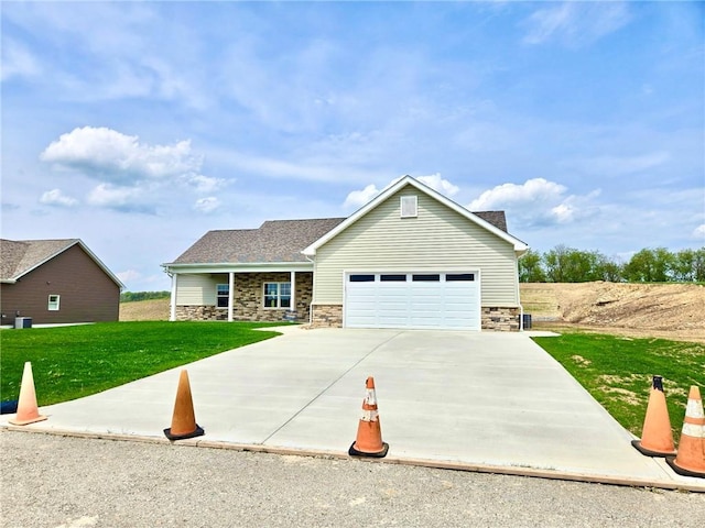 211 Ruby Dr, Menallen Twp, PA 15401 - craftsman-style home with a garage, a front lawn, driveway, and stone siding