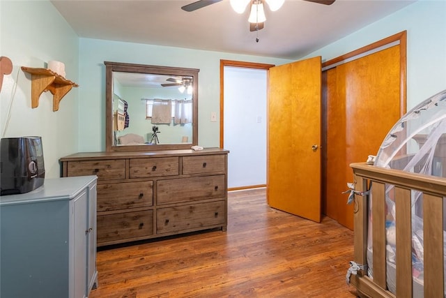 bedroom with ceiling fan and dark wood-type flooring