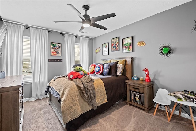 bedroom featuring light colored carpet and ceiling fan