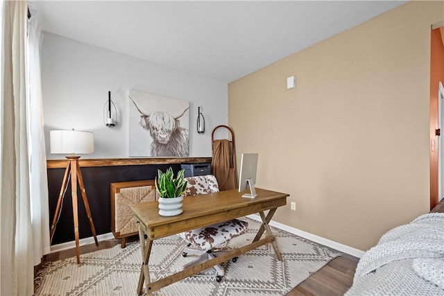 office area featuring wood finished floors and baseboards