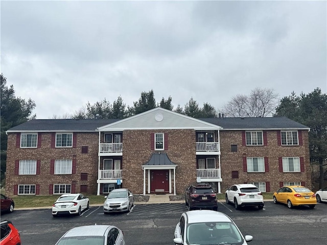 view of property with uncovered parking