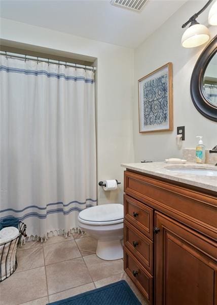 bathroom with toilet, tile patterned flooring, vanity, and visible vents