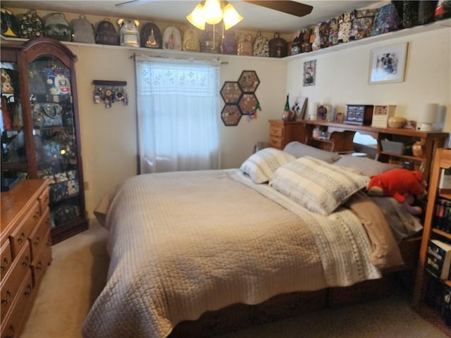 carpeted bedroom with a ceiling fan