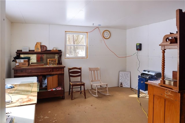 living area featuring concrete flooring