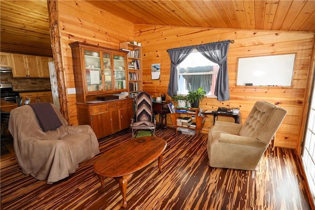 sitting room with vaulted ceiling, wood walls, wooden ceiling, and wood finished floors