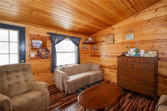 sitting room with vaulted ceiling, wood ceiling, and wooden walls