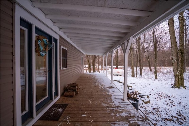 view of snow covered deck