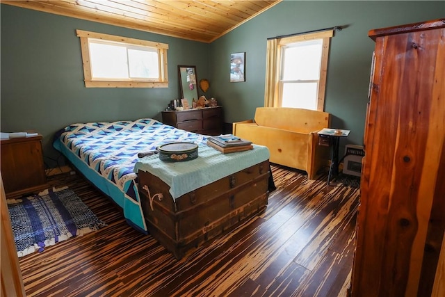 bedroom featuring lofted ceiling, dark wood-type flooring, and wooden ceiling