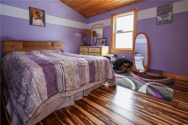 bedroom with lofted ceiling, wooden ceiling, and wood finished floors