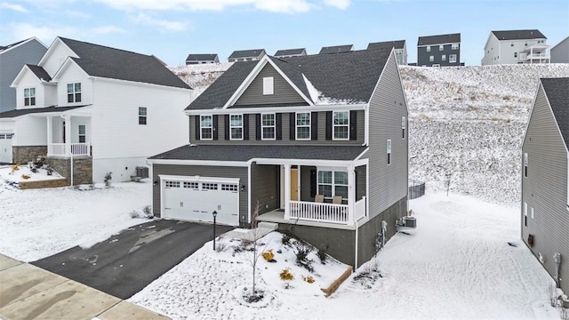 traditional home featuring a porch, a residential view, central AC, and driveway