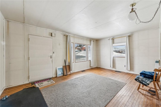 entryway featuring light wood-type flooring and visible vents