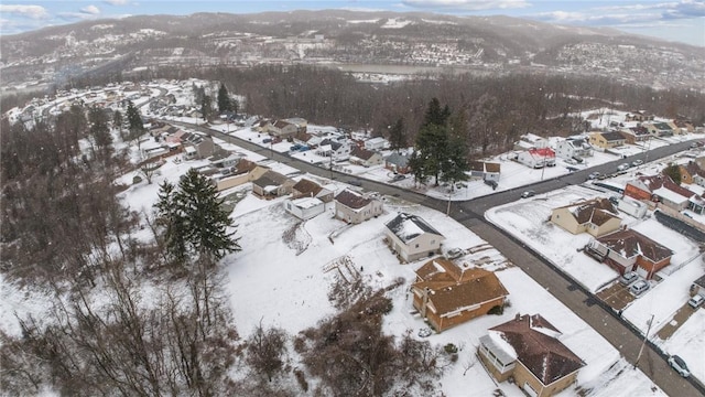 snowy aerial view with a residential view