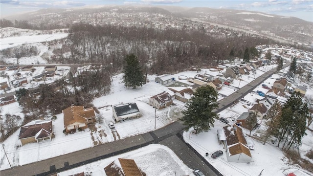 snowy aerial view featuring a residential view