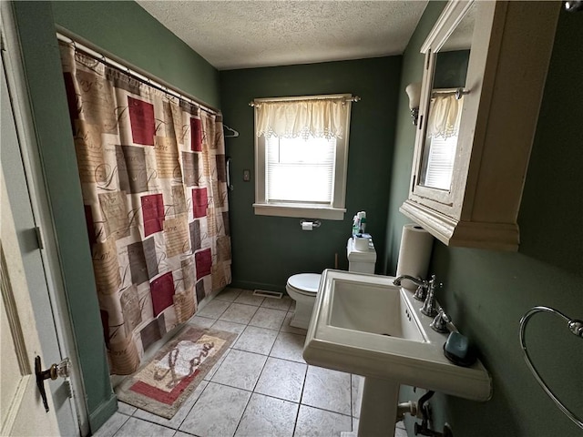 full bath featuring visible vents, toilet, tile patterned floors, shower / bathtub combination with curtain, and a textured ceiling