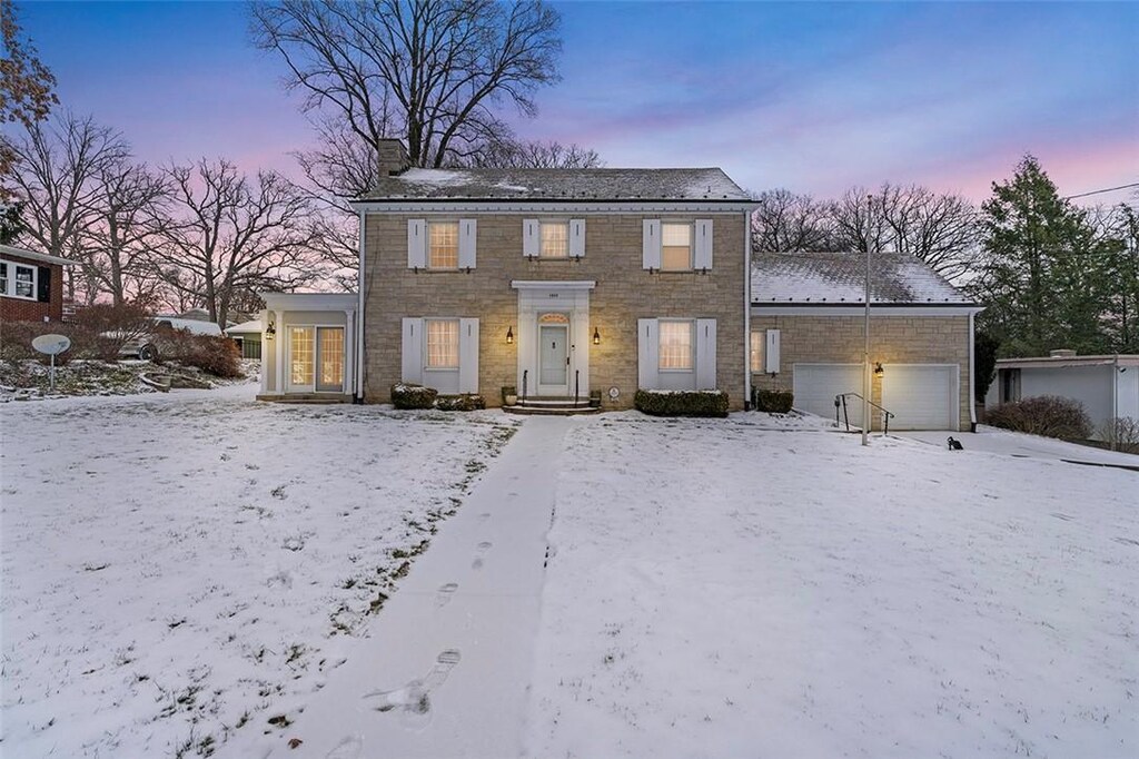 colonial home with a garage