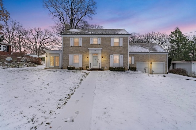 colonial home with a garage