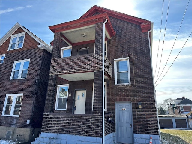 view of property with brick siding