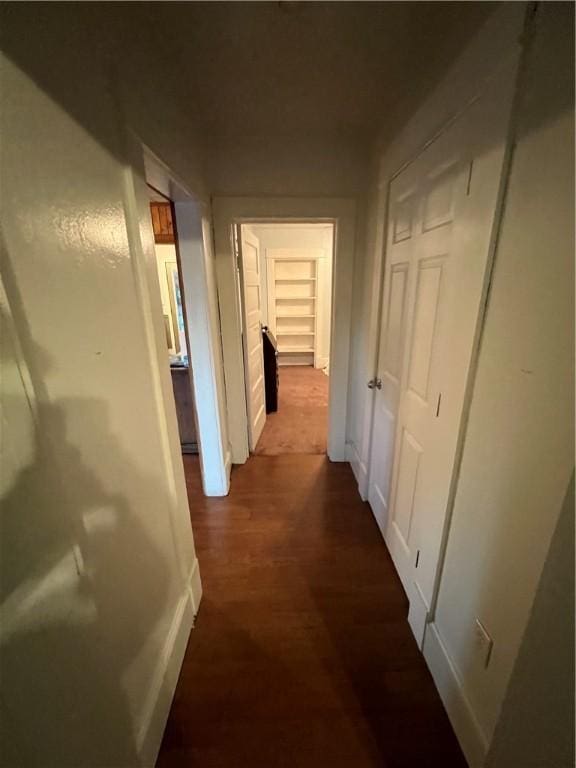 hallway featuring dark wood finished floors