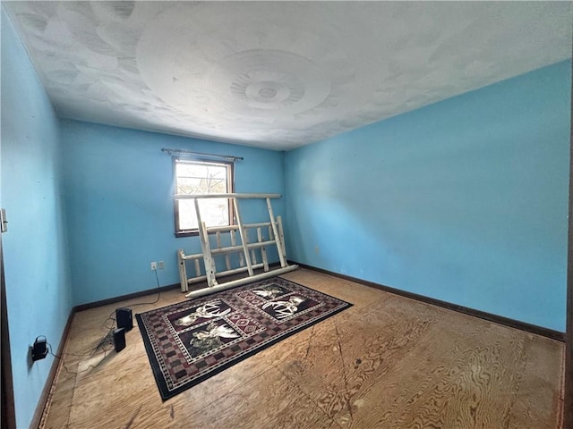 spare room featuring baseboards