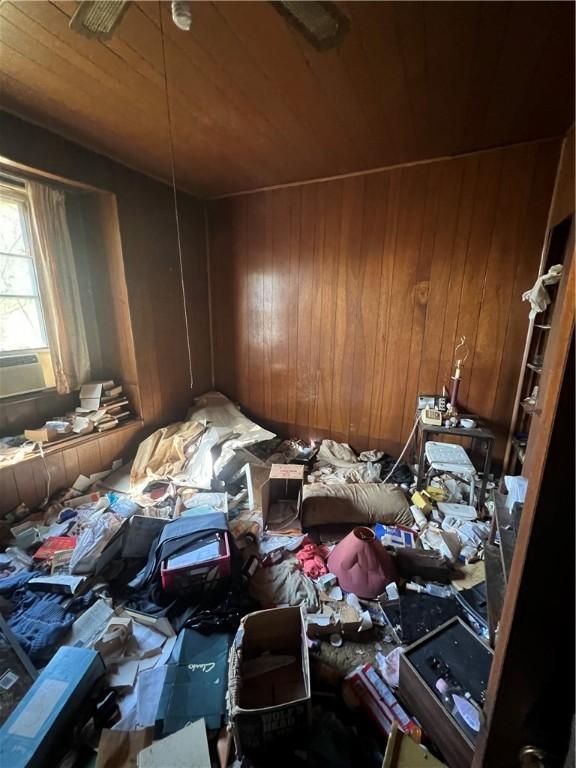 miscellaneous room featuring wood ceiling and wooden walls