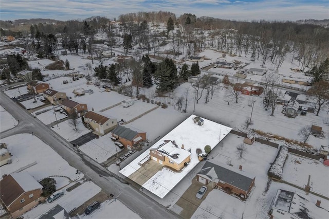 snowy aerial view with a residential view