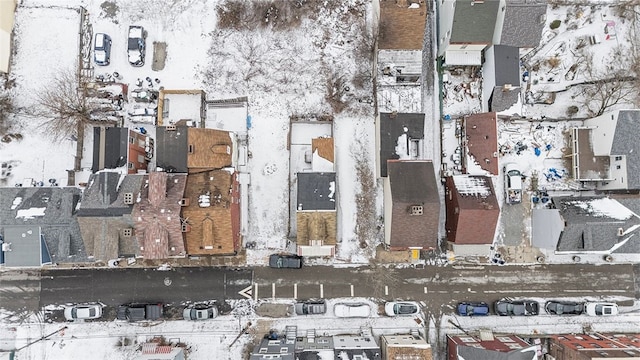 snowy aerial view with a residential view