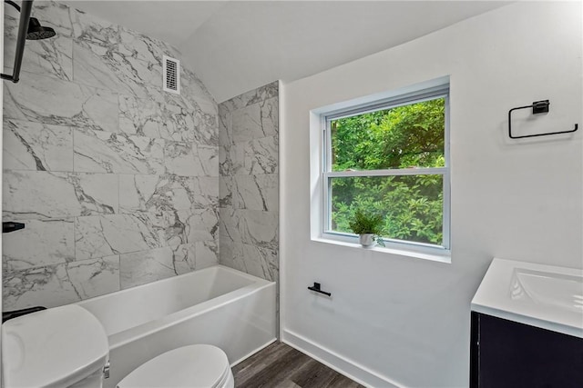 bathroom with shower / bathtub combination, toilet, wood finished floors, vanity, and visible vents