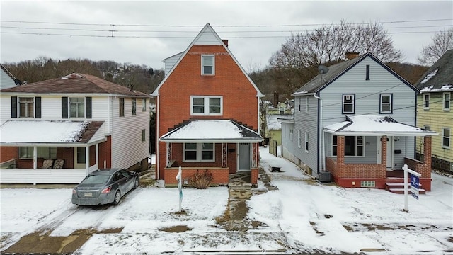 view of front of home featuring brick siding