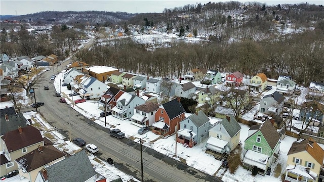 snowy aerial view with a residential view