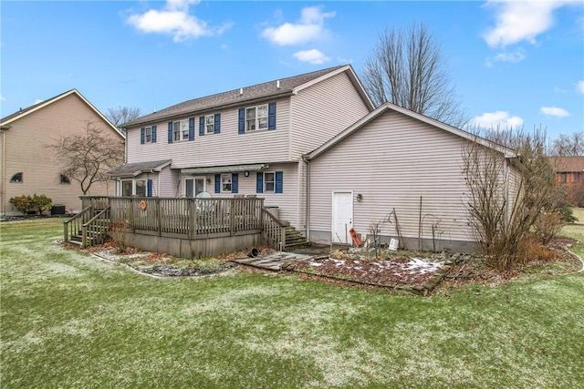 rear view of house with a yard, a wooden deck, and stairs