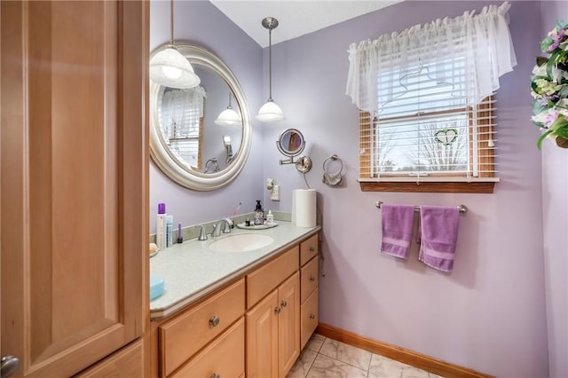 bathroom with vanity and baseboards