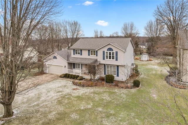 traditional home with an outbuilding, a garage, concrete driveway, a shed, and a front lawn