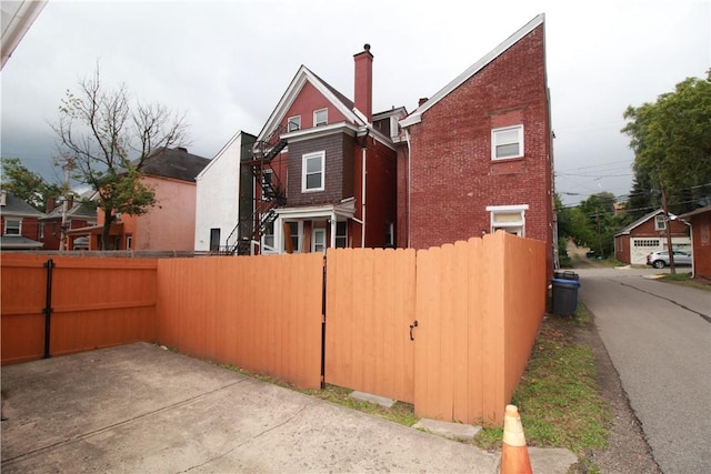 754 N Sheridan Ave, Highland Park, PA 15206 - view of side of property with brick siding and a chimney