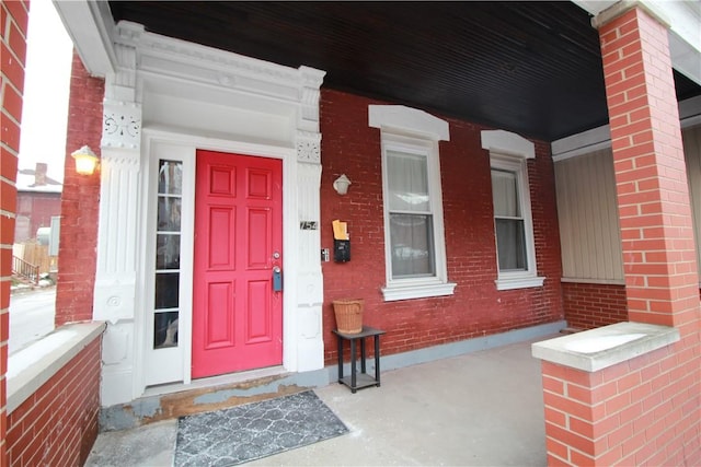 754 N Sheridan Ave, Highland Park, PA 15206 - property entrance featuring a porch and brick siding