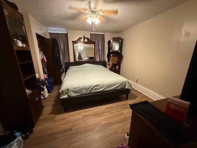 754 N Sheridan Ave, Highland Park, PA 15206 - bedroom featuring a textured ceiling, wood finished floors, and ceiling fan