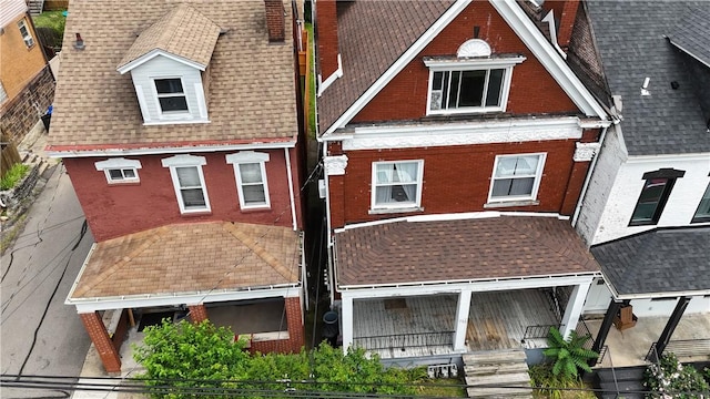 754 N Sheridan Ave, Highland Park, PA 15206 - view of front of house with a chimney and brick siding