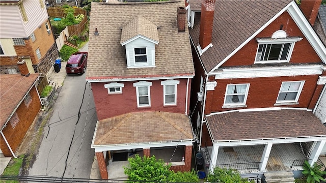 754 N Sheridan Ave, Highland Park, PA 15206 - rear view of house featuring brick siding, a shingled roof, and a chimney