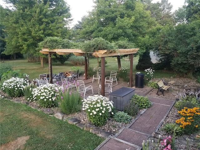 view of yard with an outdoor fire pit