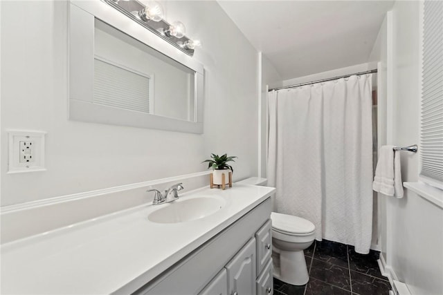 full bathroom featuring toilet, tile patterned floors, and vanity