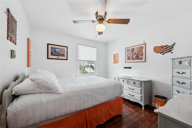 bedroom featuring a ceiling fan and dark wood-style flooring