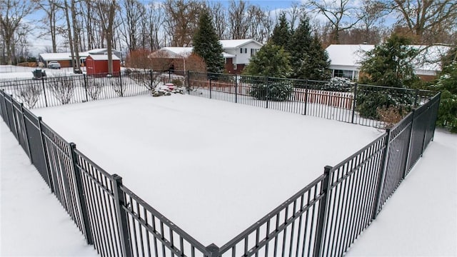 snowy yard with fence