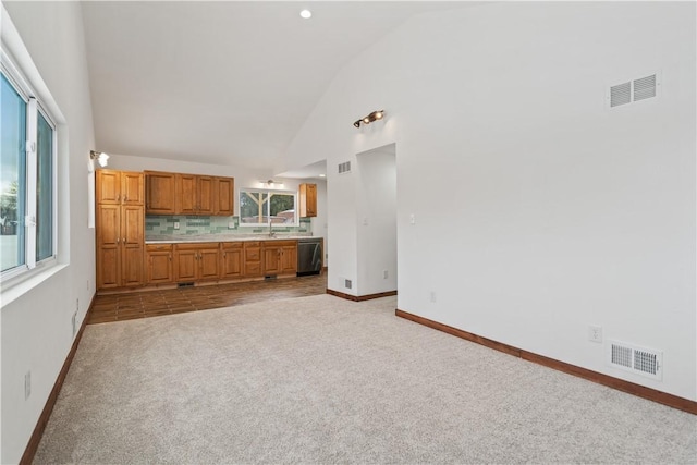 kitchen with light carpet, visible vents, light countertops, and dishwasher