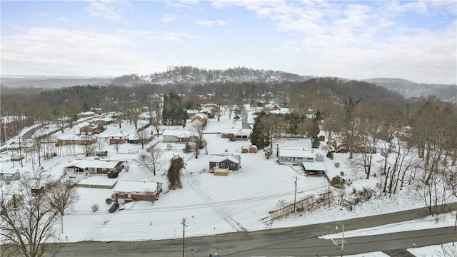 snowy aerial view featuring a mountain view