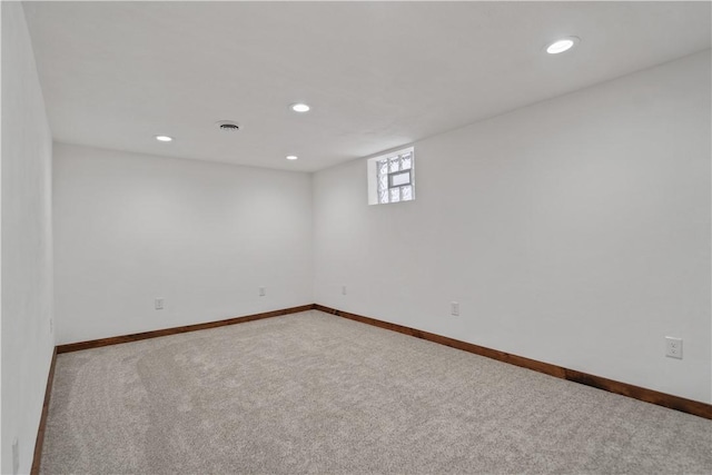 below grade area with baseboards, carpet flooring, and recessed lighting