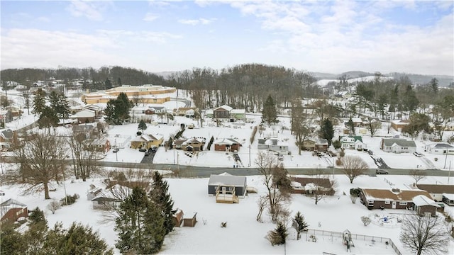 snowy aerial view featuring a residential view